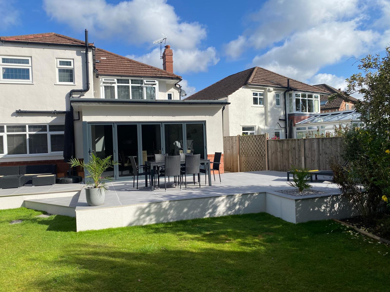 Rear extension with bi-fold doors and new porcelain patio built by Pavedway, Manchester