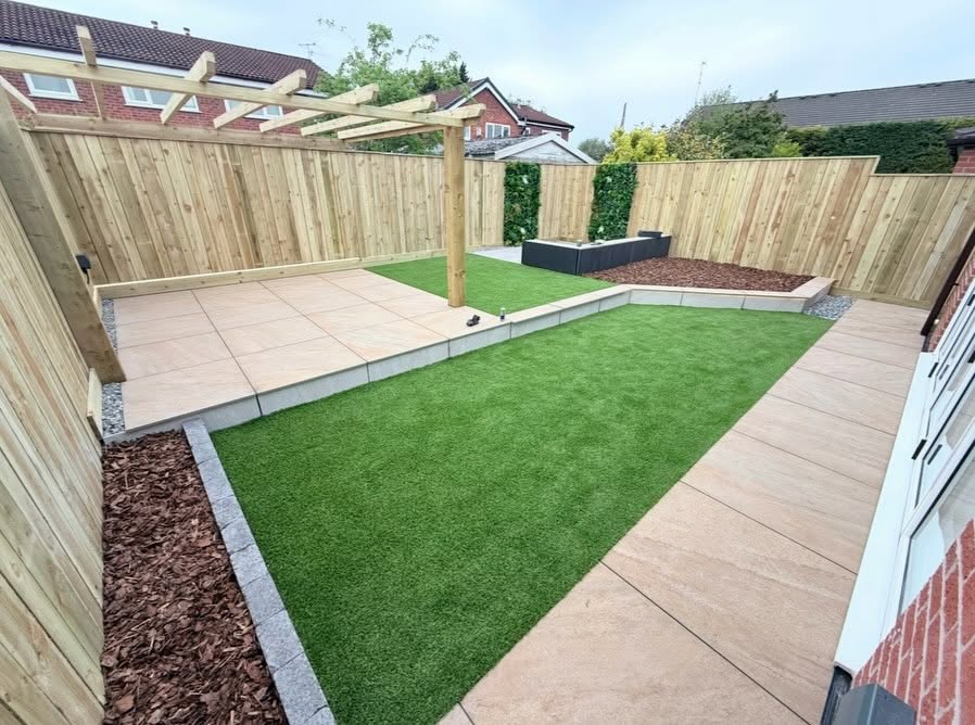 Landscaped garden with timber pergola, turf and paved patio