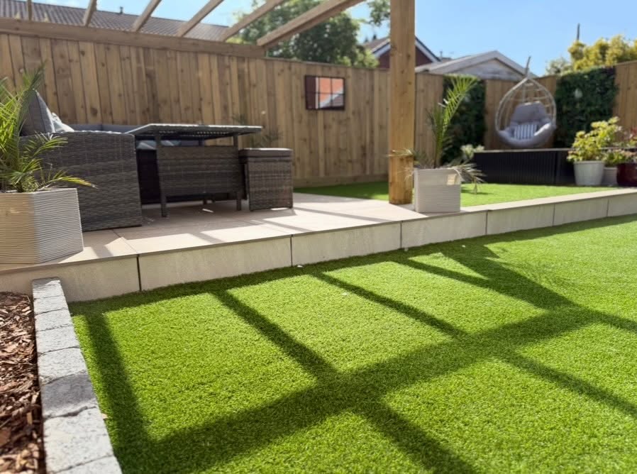 Full garden renovation with pergola, patio and hanging egg chair, built by Pavedway